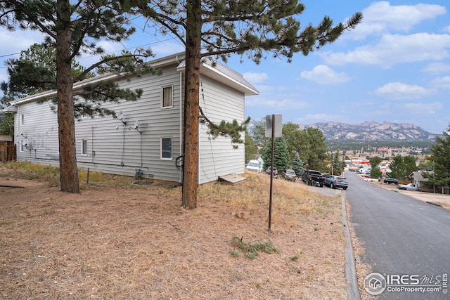 view of side of property featuring a mountain view