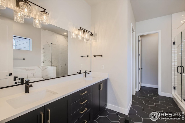 bathroom featuring vanity, a chandelier, tile patterned flooring, and walk in shower