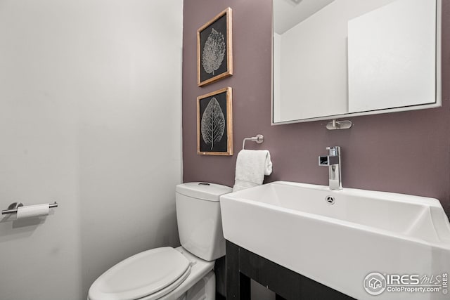 bathroom featuring sink and toilet