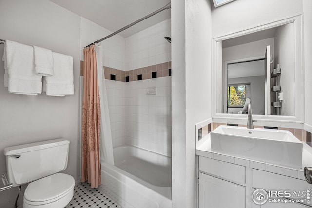 full bathroom with toilet, shower / bathtub combination with curtain, tile patterned floors, and vanity