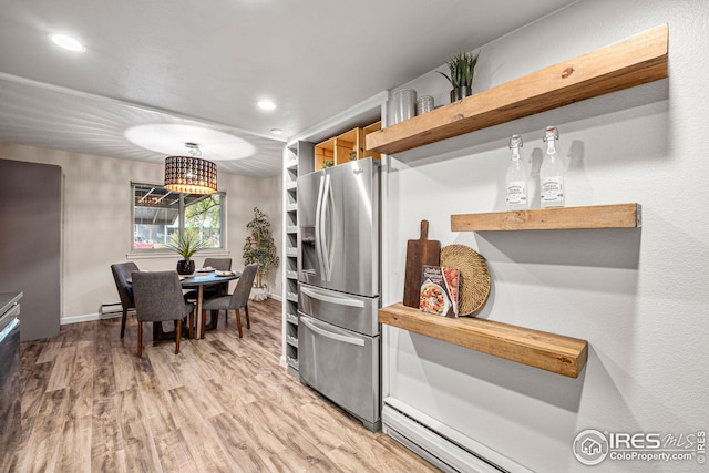 kitchen featuring light hardwood / wood-style flooring and stainless steel refrigerator with ice dispenser