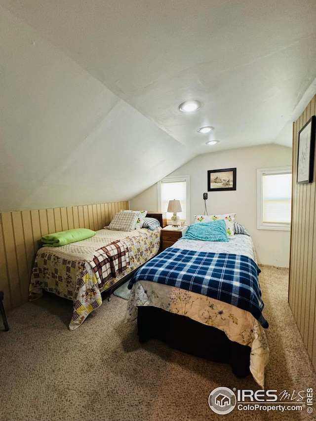 bedroom featuring carpet and vaulted ceiling