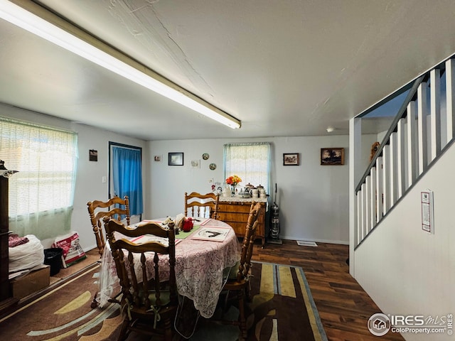 dining room with dark wood-type flooring