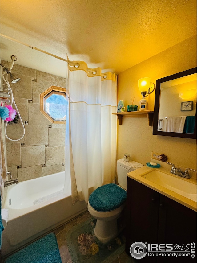 full bathroom with vanity, toilet, a textured ceiling, and shower / tub combo