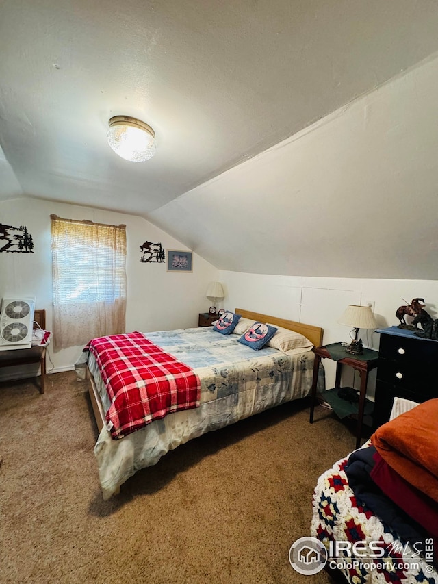 bedroom featuring carpet flooring and lofted ceiling