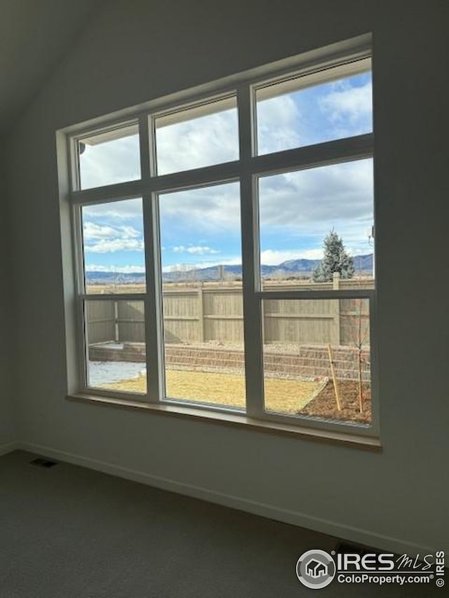 spare room with visible vents and baseboards