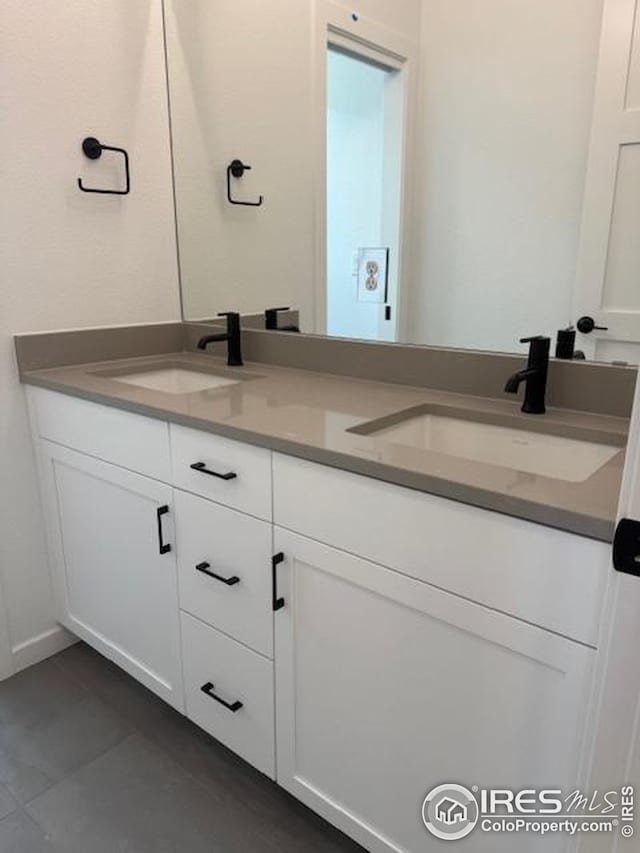 bathroom with double vanity and a sink