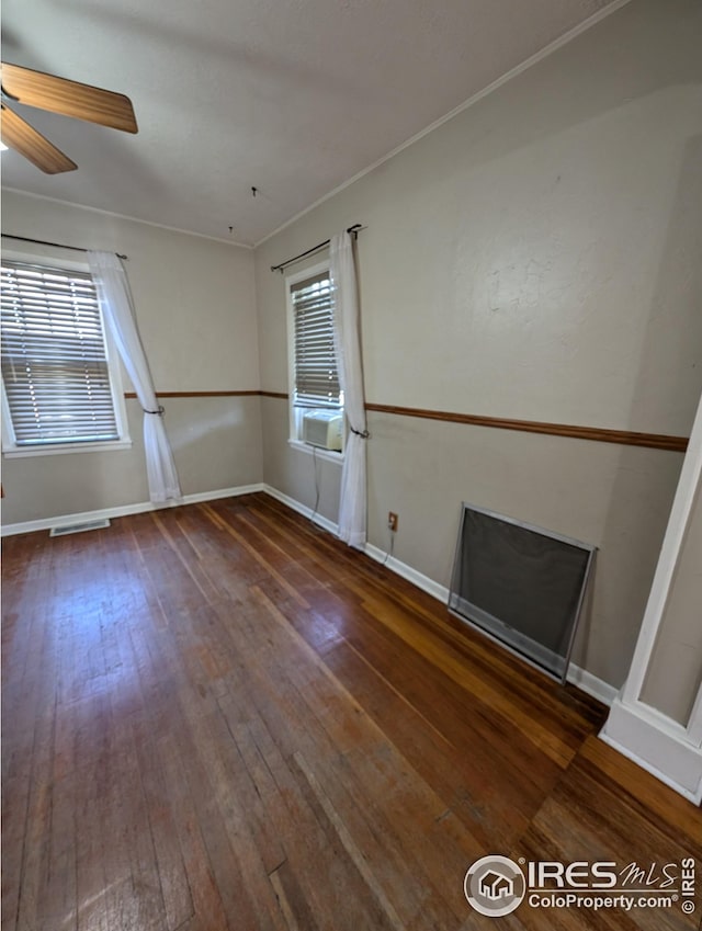 unfurnished room featuring dark hardwood / wood-style floors and ceiling fan