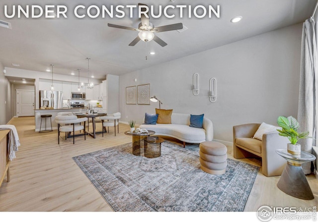 968 Birdwhistle Ln Unit 4, Fort Collins, CO 80524 - living area featuring baseboards, recessed lighting, ceiling fan, and light wood-style flooring