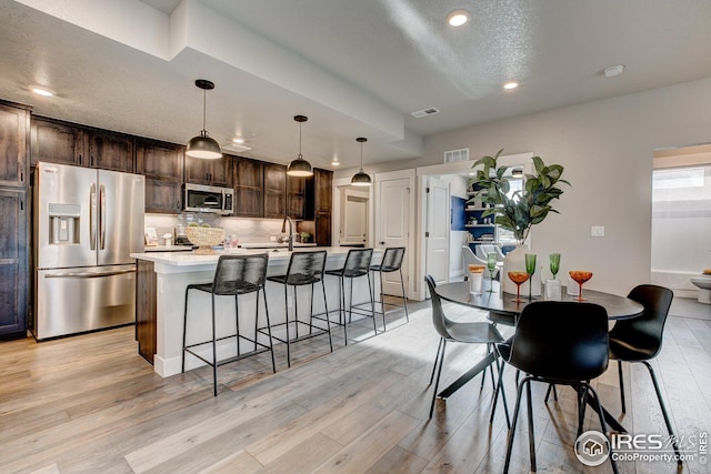 968 Birdwhistle Ln Unit 3, Fort Collins, CO 80524 - dining room with recessed lighting, visible vents, and light wood-type flooring