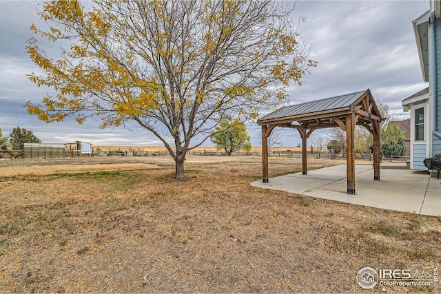 view of yard with a gazebo, a patio, and fence
