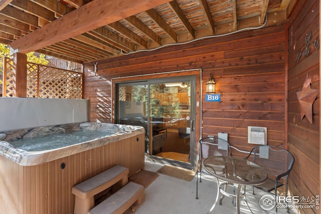 view of patio / terrace with a hot tub