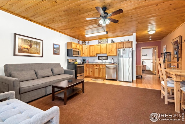 living room with wood ceiling, light hardwood / wood-style flooring, sink, crown molding, and ceiling fan