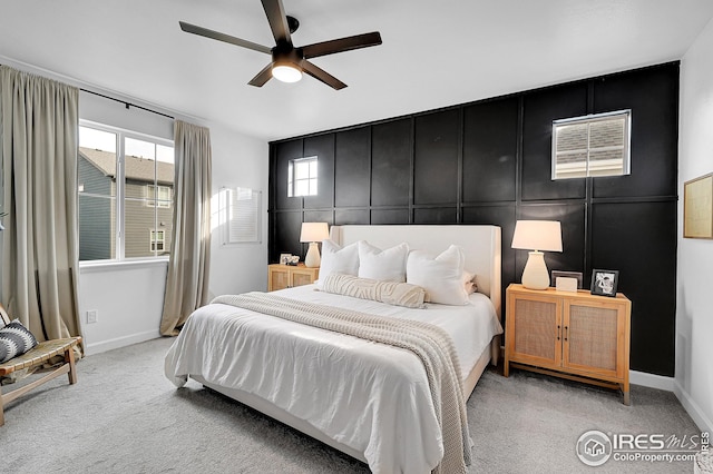 bedroom featuring ceiling fan and light carpet