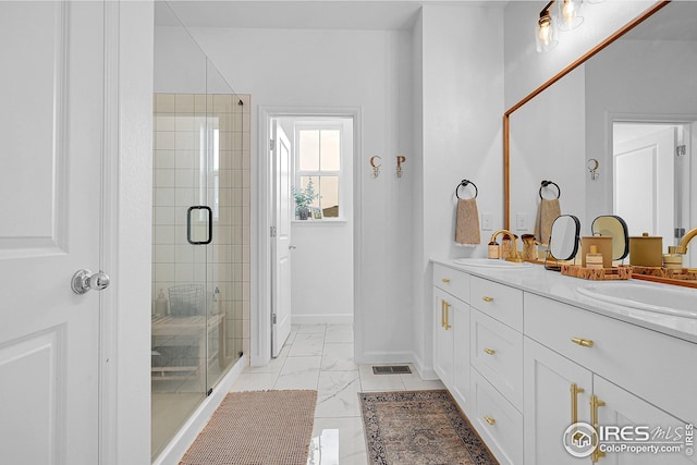 bathroom with vanity and an enclosed shower