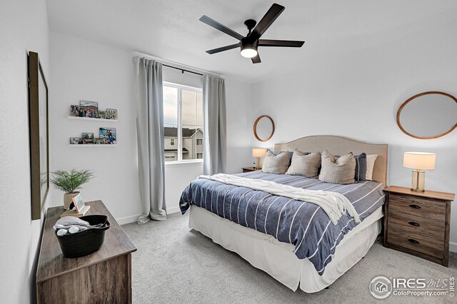 carpeted bedroom featuring ceiling fan