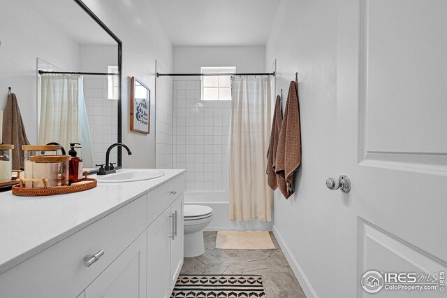 full bathroom with vanity, shower / bathtub combination with curtain, and toilet