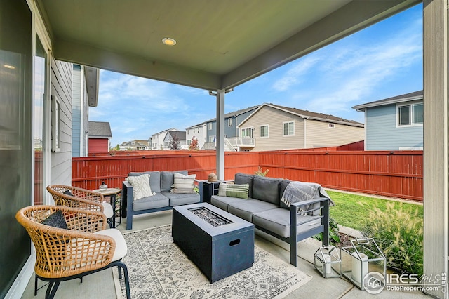 view of patio / terrace featuring an outdoor living space with a fire pit