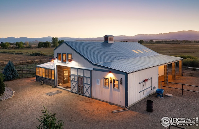 view of front of home with an outbuilding and a mountain view