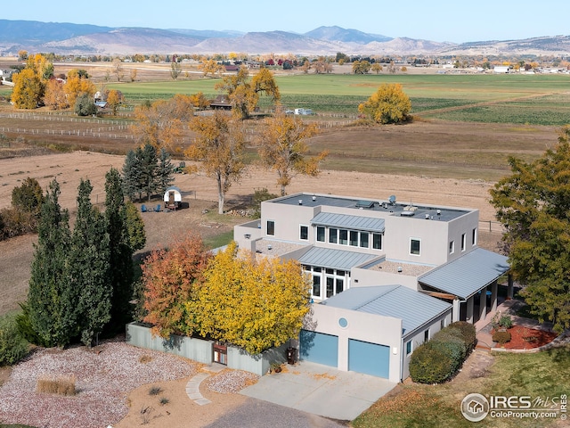 aerial view with a mountain view and a rural view