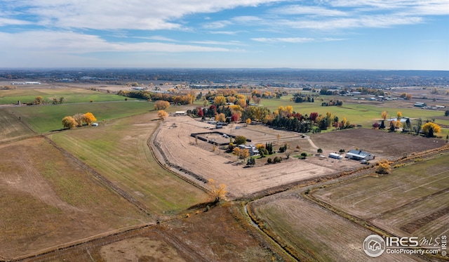 birds eye view of property featuring a rural view