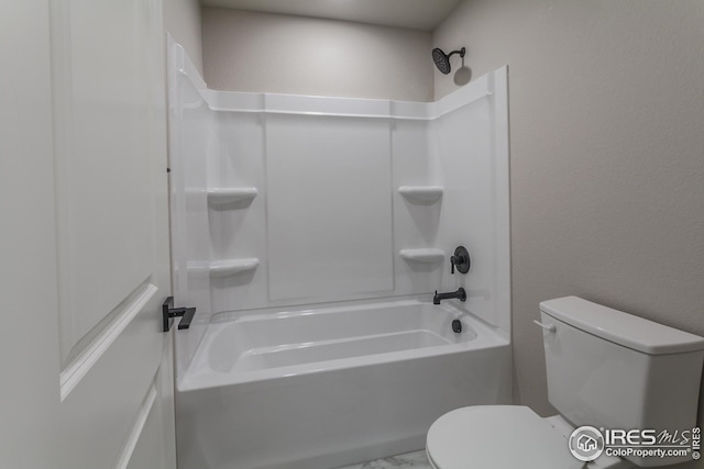 bathroom with shower / bath combination and toilet