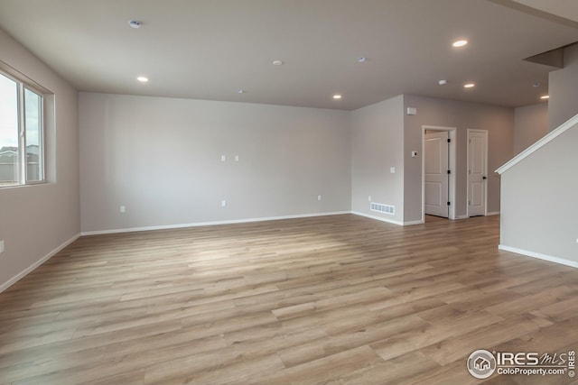 spare room featuring light hardwood / wood-style floors