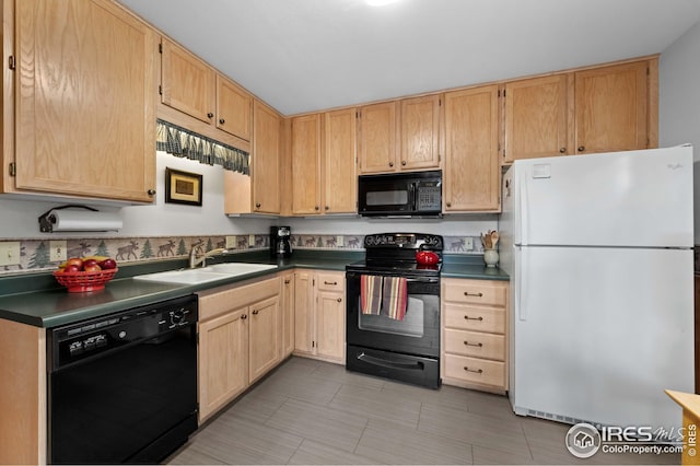 kitchen featuring a sink, light brown cabinets, black appliances, and dark countertops