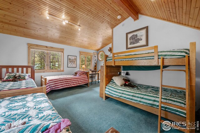 carpeted bedroom featuring vaulted ceiling with beams and wood ceiling
