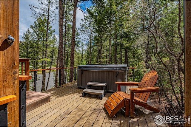 wooden deck with a hot tub
