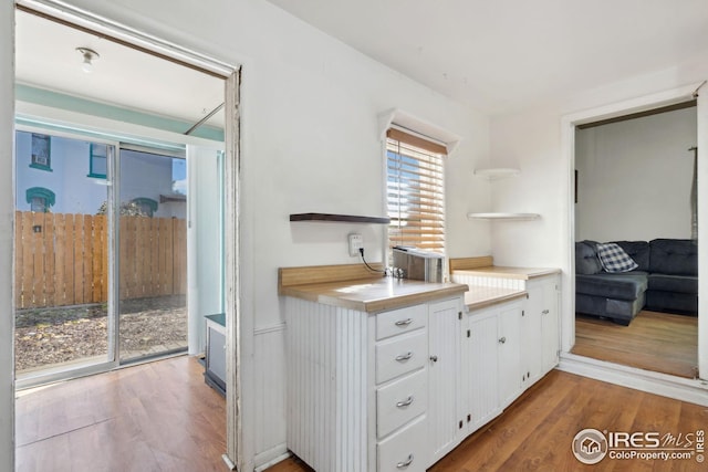 kitchen featuring white cabinets and hardwood / wood-style floors