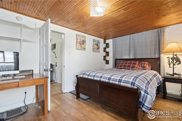 bedroom featuring hardwood / wood-style flooring and wooden ceiling