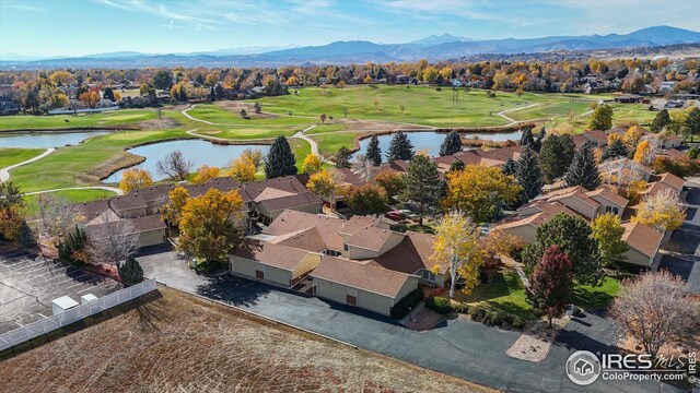 bird's eye view featuring golf course view, a residential view, and a water and mountain view