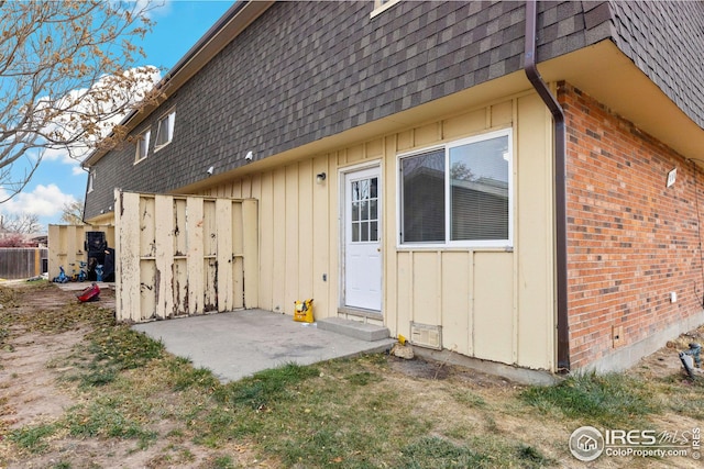 view of side of home with a patio area