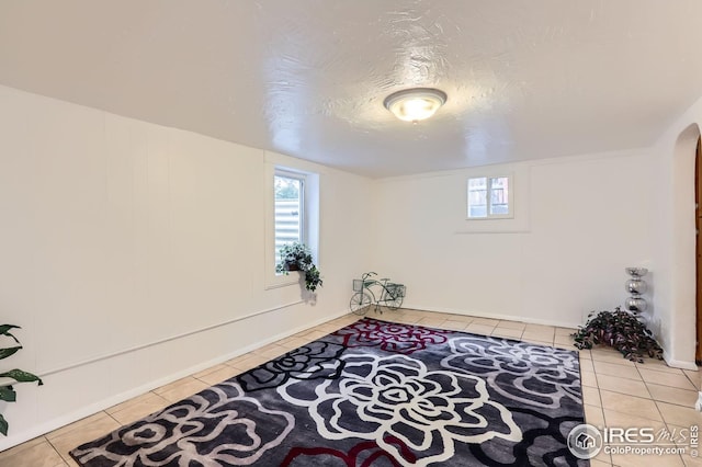 1127 W Mulberry St, Fort Collins, CO 80521 - below grade area with tile patterned flooring and arched walkways
