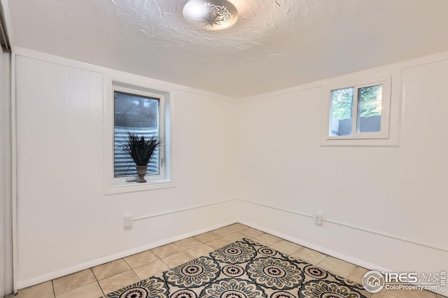 1127 W Mulberry St, Fort Collins, CO 80521 - spare room with light tile patterned floors and baseboards