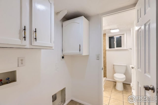 1127 W Mulberry St, Fort Collins, CO 80521 - laundry area with hookup for a washing machine, light tile patterned floors, baseboards, and heating unit