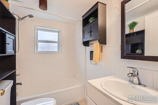 1127 W Mulberry St, Fort Collins, CO 80521 - full bathroom featuring toilet, vanity, and shower / tub combination