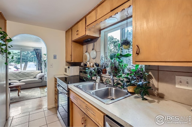 1127 W Mulberry St, Fort Collins, CO 80521 - kitchen with electric range oven, light countertops, a sink, light tile patterned floors, and white microwave