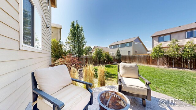 view of patio with a fire pit