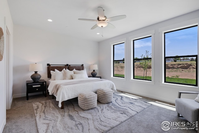 carpeted bedroom with ceiling fan, baseboards, and recessed lighting