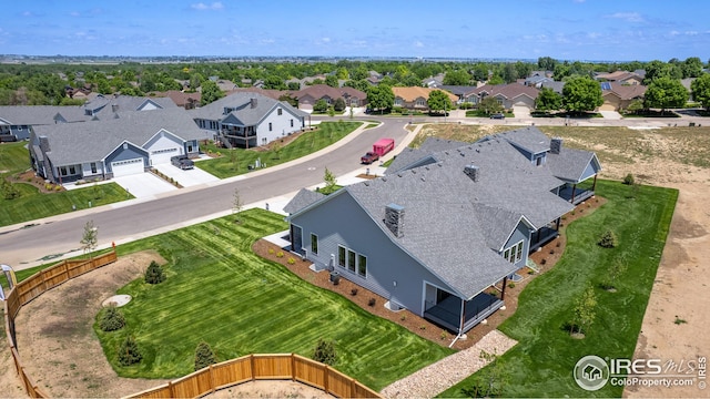 birds eye view of property with a residential view