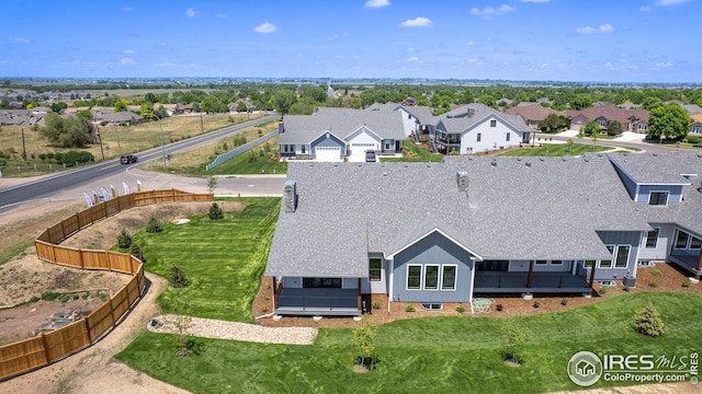 birds eye view of property with a residential view