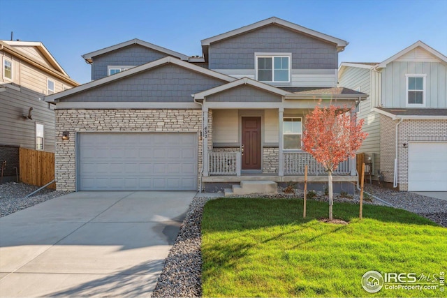 view of front facade with a garage and a front yard