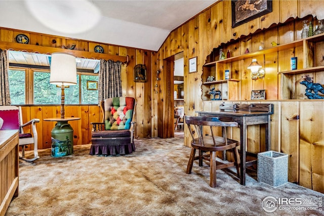 interior space with wood walls, lofted ceiling, and carpet floors