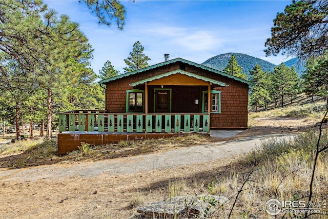 bungalow-style house featuring a mountain view and covered porch