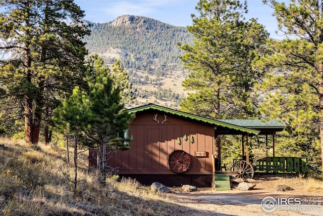 view of outdoor structure with a mountain view