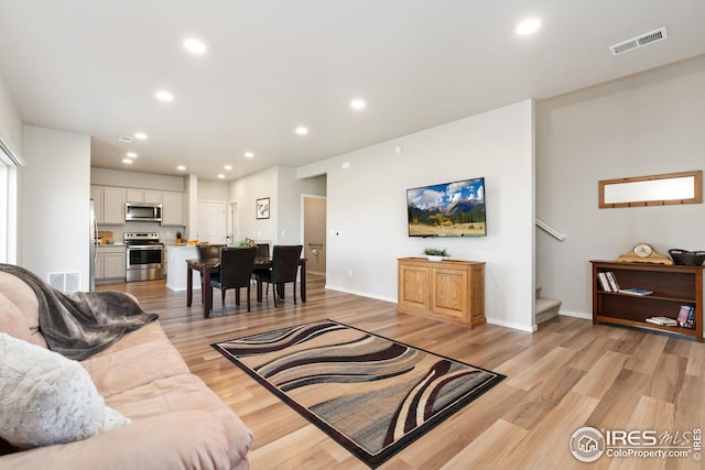 living room featuring light wood-type flooring