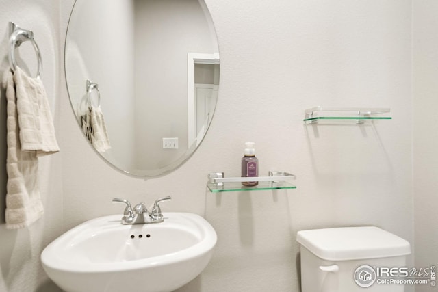 bathroom with toilet and sink