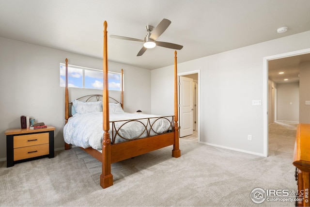 bedroom with light colored carpet and ceiling fan